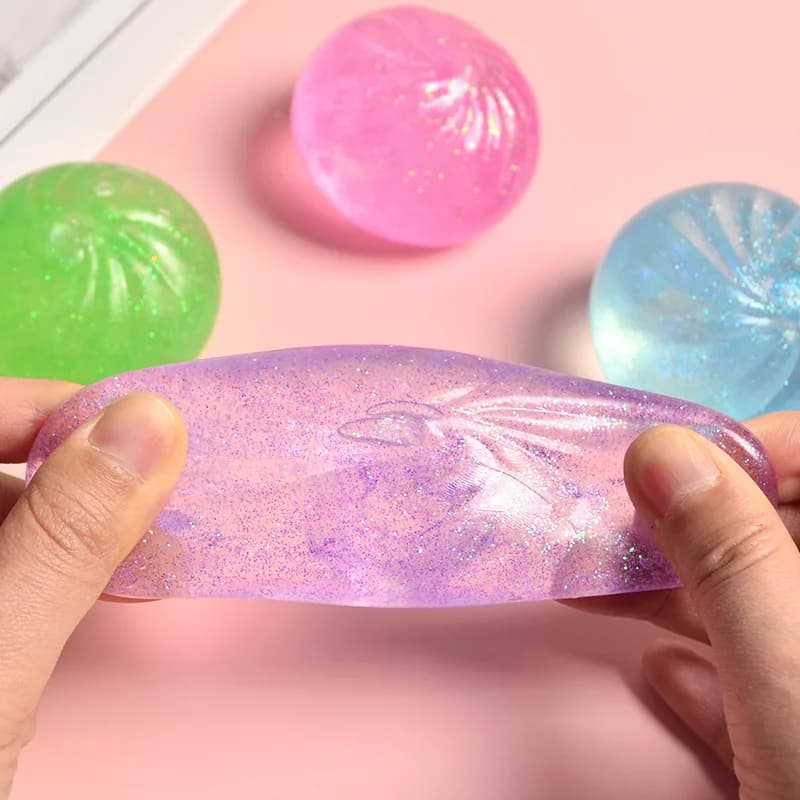 Mini gniotek „pieróg” – realistyczna bułeczka, sensoryczna zabawka typu fidget z kolorowym brokatem, antystresowa kulka w formie bułki na parze, mała zabawka do ściskania.